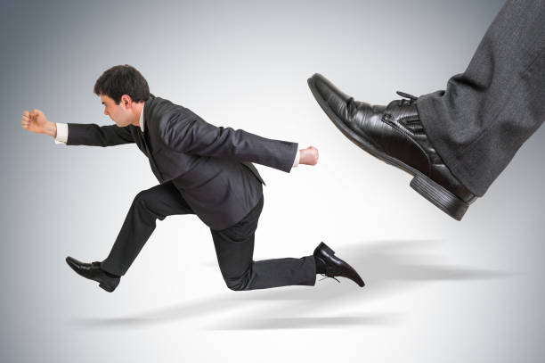 istock Small businessman running away from a boss pressure 875183384