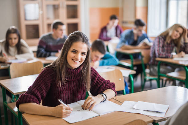 istock Happy high school student during a class in the classroom. 875183650