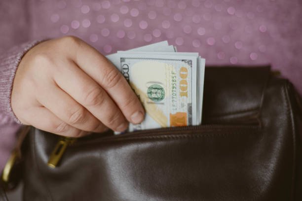 istock American dollars bank note in hand American dollars bank note in hand 875186824