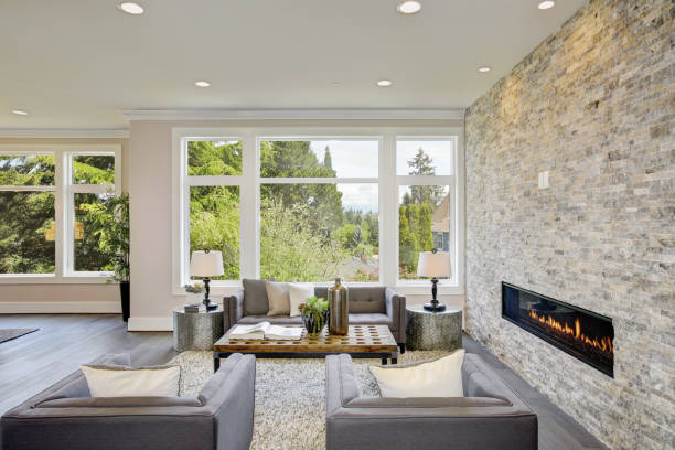 istock Modern great room with a floor to ceiling stone fireplace 875190574