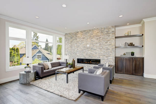 istock Modern great room with a floor to ceiling stone fireplace 875190866