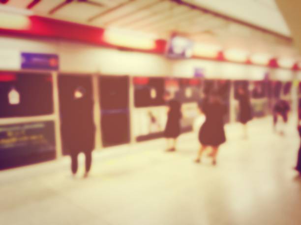 istock blurred image of passenger waiting  in line (queue) for their respective public transport during rush hour, Stay in the crowd cause stress in everyday life. vintage and film effect. 875194318