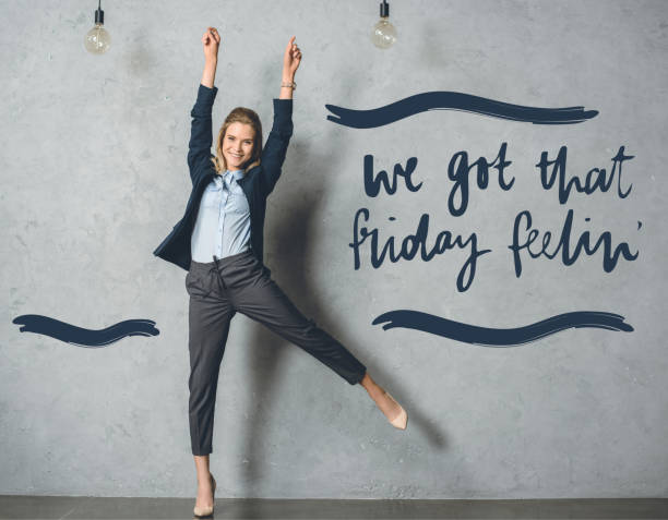 happy businesswoman in suit happy businesswoman in suit with outstretched arms looking at camera friday stock pictures, royalty-free photos & images