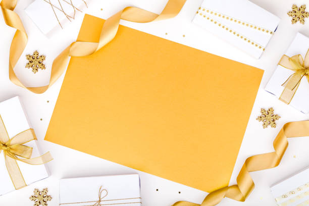 istock christmas or new year frame composition. christmas decorations in gold colors on white background with empty copy space for text. holiday and celebration concept for postcard or invitation. top view 875202868
