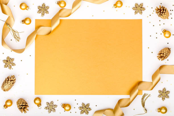 istock christmas or new year frame composition. christmas decorations in gold colors on white background with empty copy space for text. holiday and celebration concept for postcard or invitation. top view 875202956
