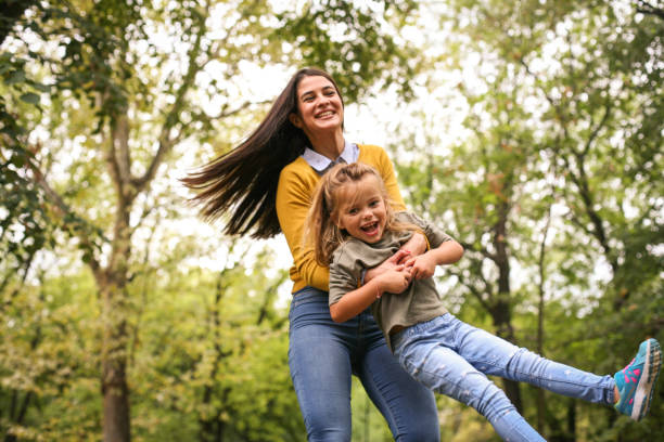 istock Mother playing with daughter. On the move. 875206956