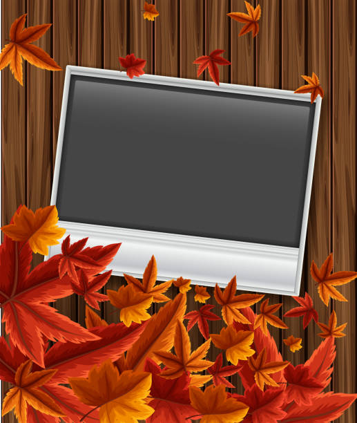 istock Photoframe on wooden board with leaves 875212774