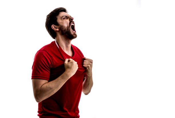istock Fan / Sport Player on red uniform celebrating on white background 875218366
