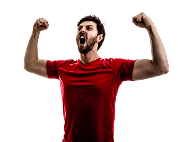 istock Fan / Sport Player on red uniform celebrating on white background 875218372