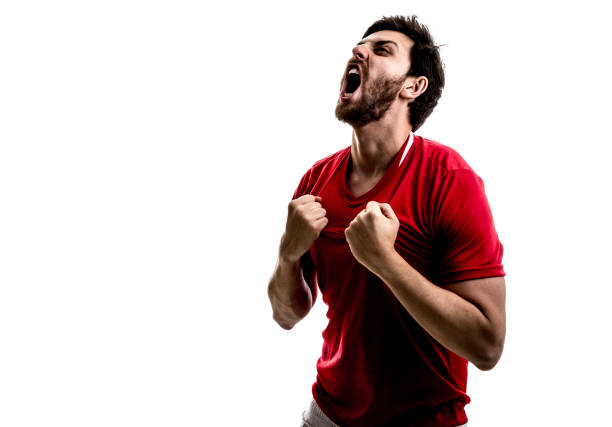 istock Fan / Sport Player on red uniform celebrating on white background 875218380