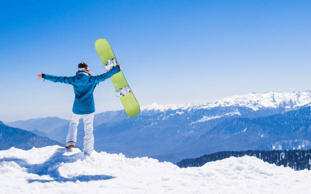 istock young  snowboarder woman 875222550