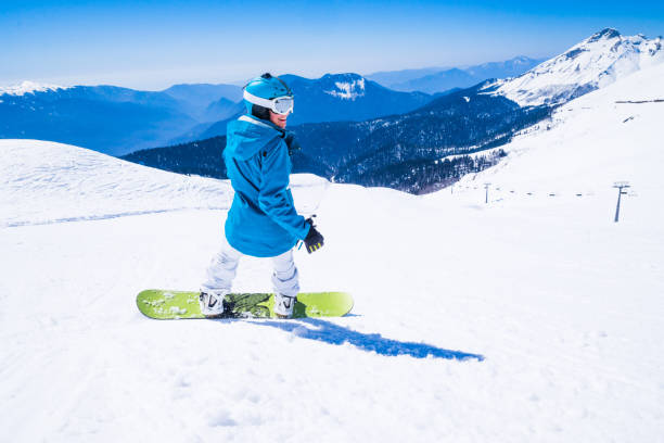 istock young  snowboarder woman 875222554
