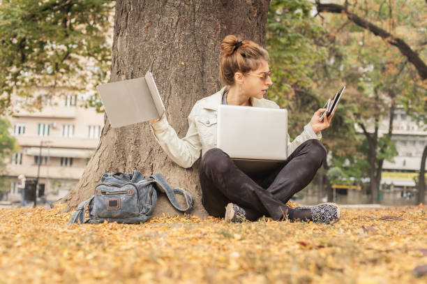 istock Hysterical girl with too many screens, mobils, tablets and laptops 875229994