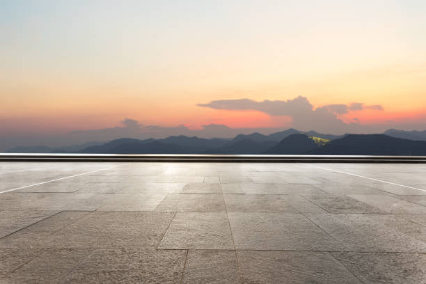 istock empty marble floor with green mountains at twilight 875233246