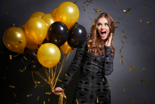 istock Woman giving a cheer for new year 875234434