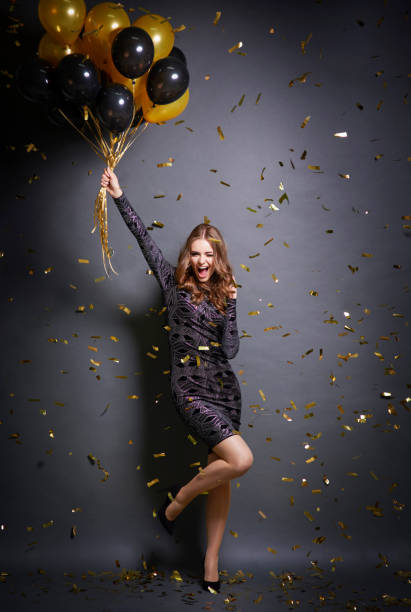 istock Exhilarated woman dancing at party 875244468