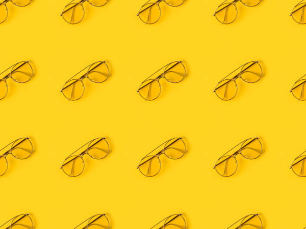 istock stylish Glasses isolated on yellow 875245054