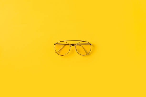 one stylish Glasses Top view of one stylish Glasses isolated on yellow animal representation photos stock pictures, royalty-free photos & images