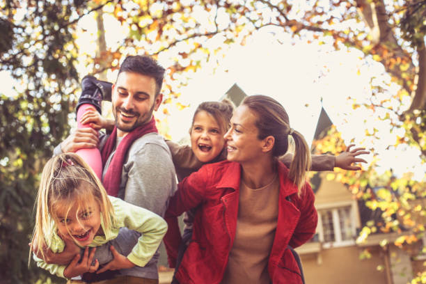 istock Happy parents have play with daughters. On the move. 875253150