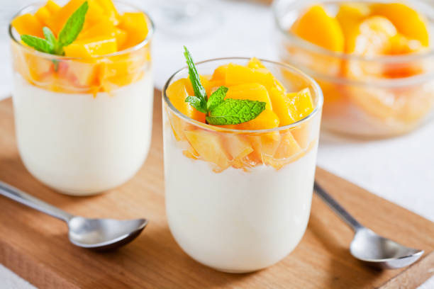 istock Glasses Of Yogurt With Poached Peaches 875253292