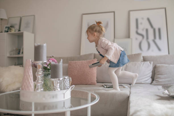 istock A young father plays at home with his daughter 875253304