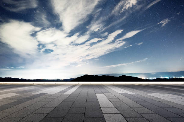 istock empty marble floor with green hill in star sky 875254150