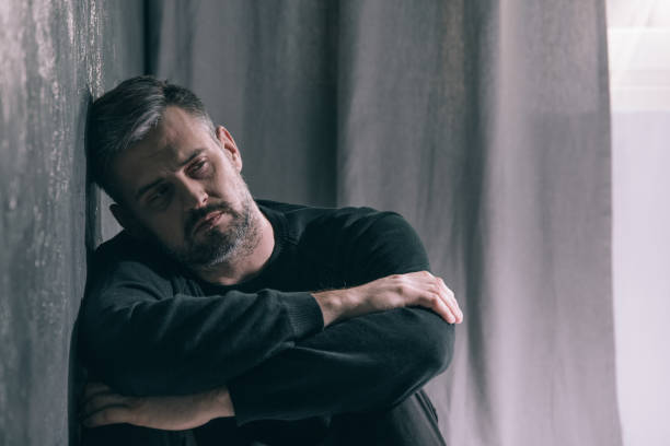 istock Sad man during autumn weather 875254266