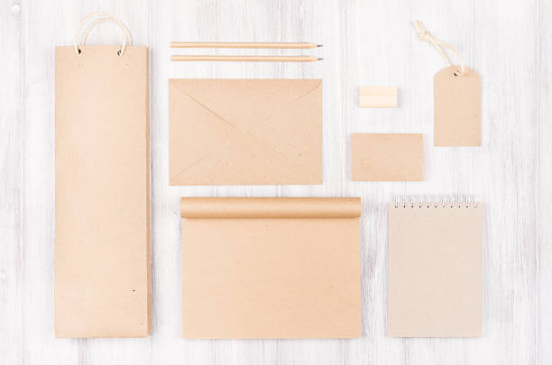 istock Corporate identity template, kraft packaging, stationery, gift  set on soft white wood background. 875255728