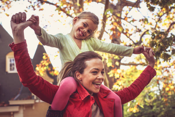 istock Mommy carrying me on shoulders. Makes me happy. 875258124