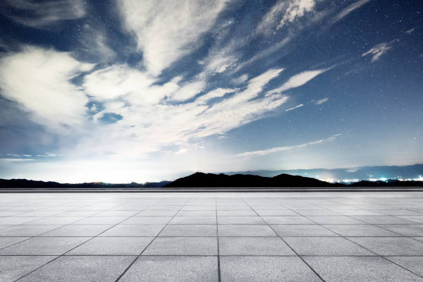 istock empty marble floor with green hill in blue sky 875258422