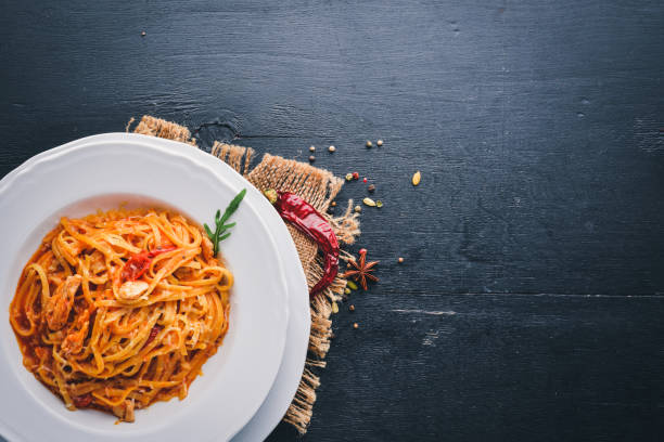 istock Ala Alio Pasta. On a wooden background. Top view. Free space for text. 875265246