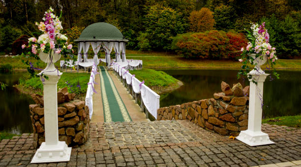 istock Gazebo in the park surrounded by fall foliage at autumn 875270070
