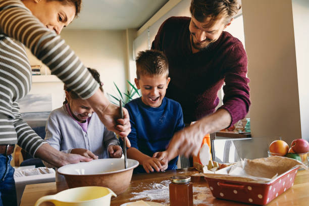 istock young family having fun baking together 875270526