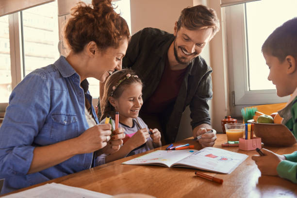 istock young family drawing together and having fun 875272978