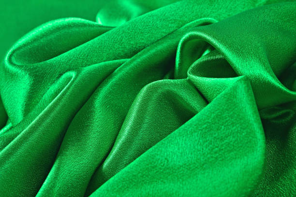 istock Natural green satin fabric texture background 875274266