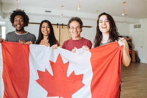 Students holding Canadian Flag