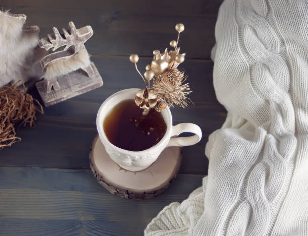 istock Christmas cup of tea on the wooden table 875280188