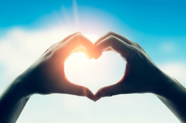 istock Hands in shape of love heart 875280278