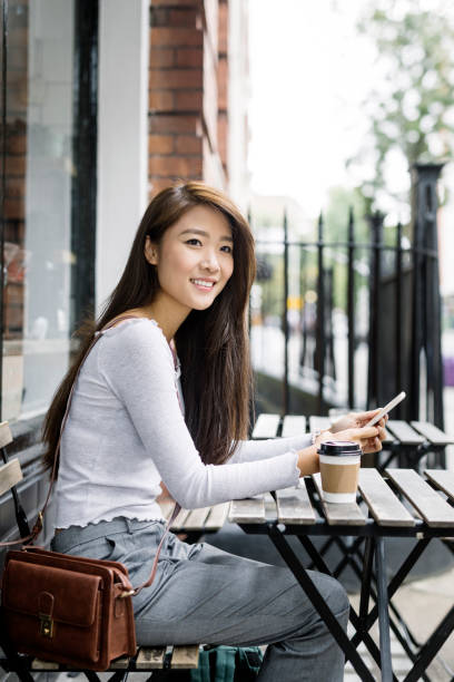 istock Young Woman With Smartphone 875280618