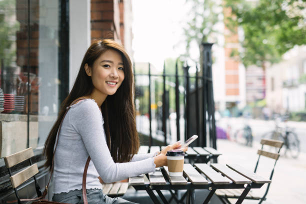 istock Young Woman With Smartphone 875280628