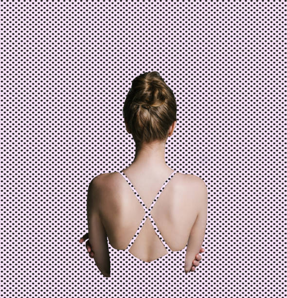 back view of woman with slim body isolated on dotted texture