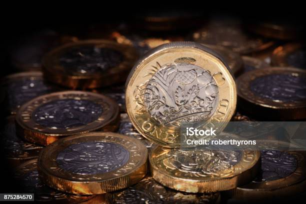 New One Pound Coin In A Spotlight Stock Photo - Download Image Now - British Coin, New, Abstract