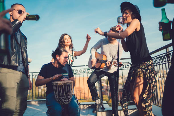 Music band performing on the rooftop Pop musicians singing on party drum percussion instrument photos stock pictures, royalty-free photos & images