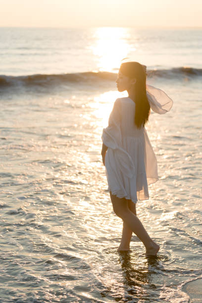 istock woman of the beach 875285776