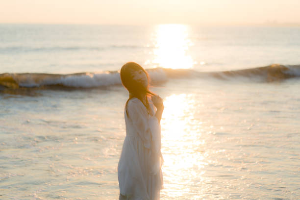istock woman of the beach 875285780