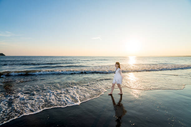 istock woman of the beach 875285784