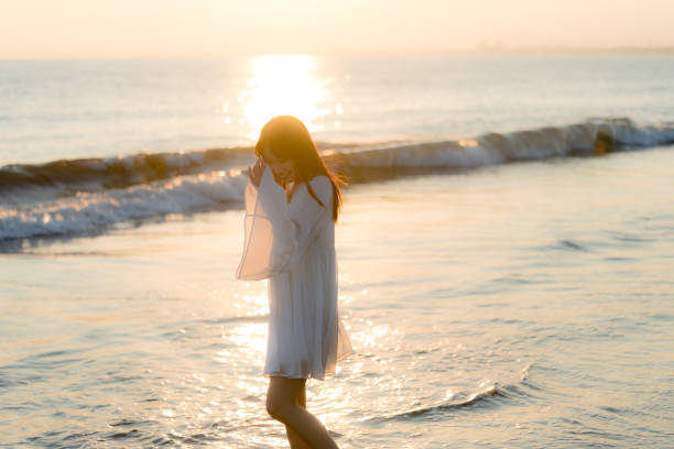 istock woman of the beach 875285852