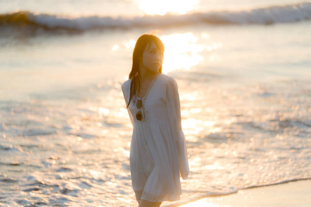 istock woman of the beach 875285878