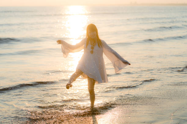 istock woman of the beach 875285890