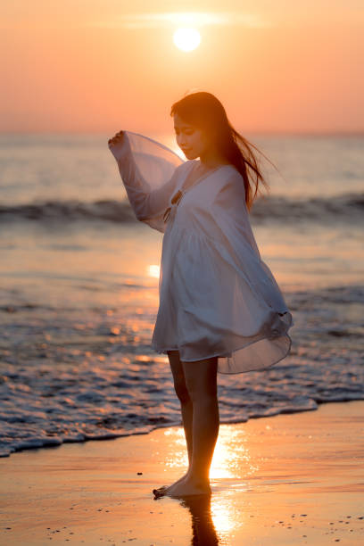 istock woman of the beach 875285944